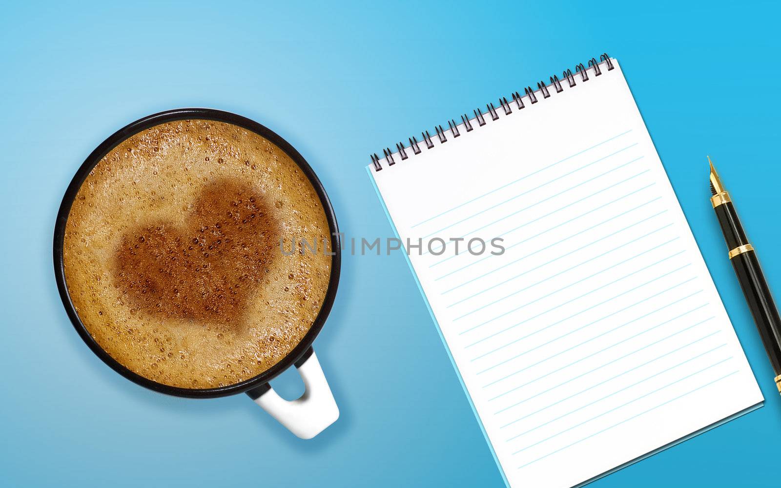 coffee art, A cup of cappuccino with love heart and notepad and pen.