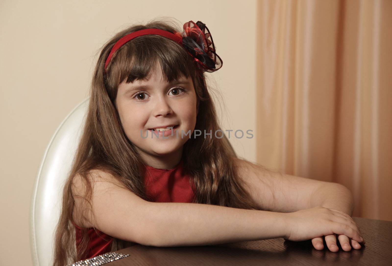 The beautiful happy young girl at home