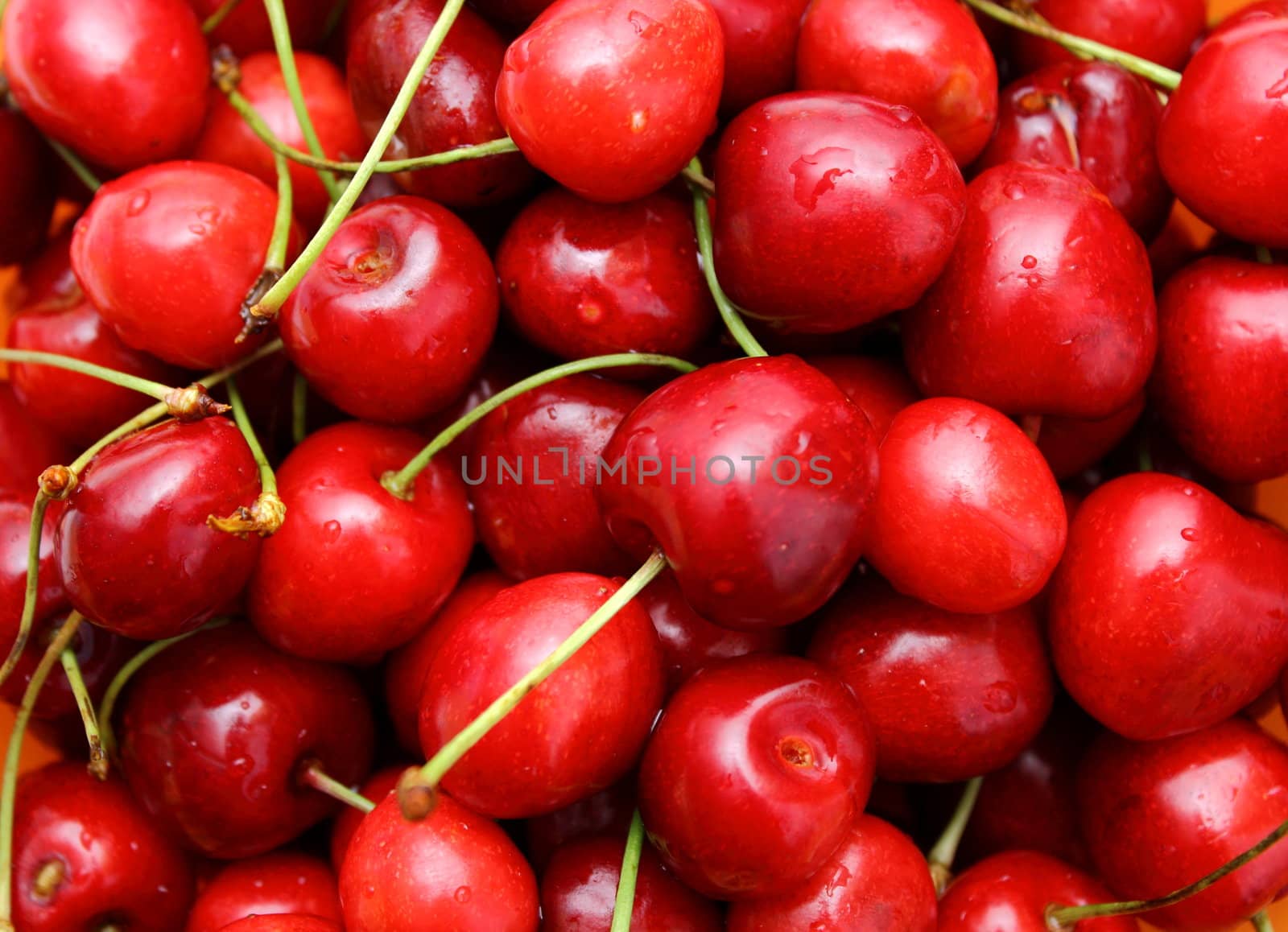 bunch of red red cherry with stem attached