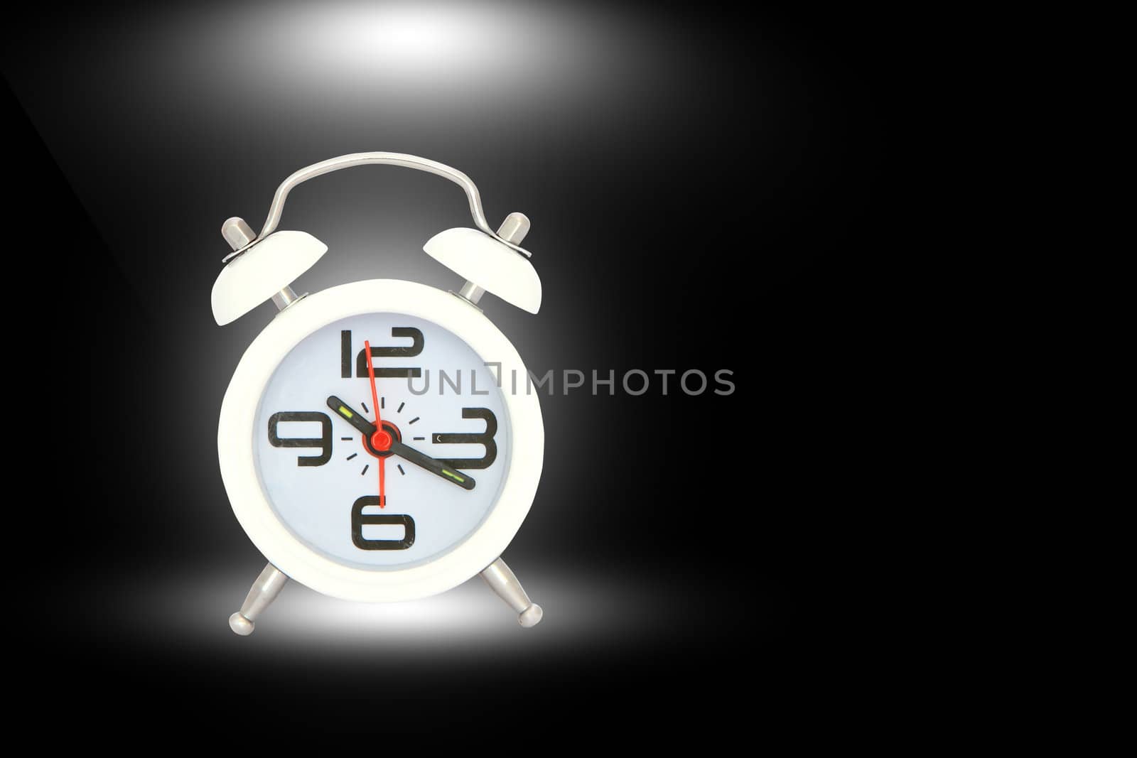    alarm clock isolated over   black by rufous