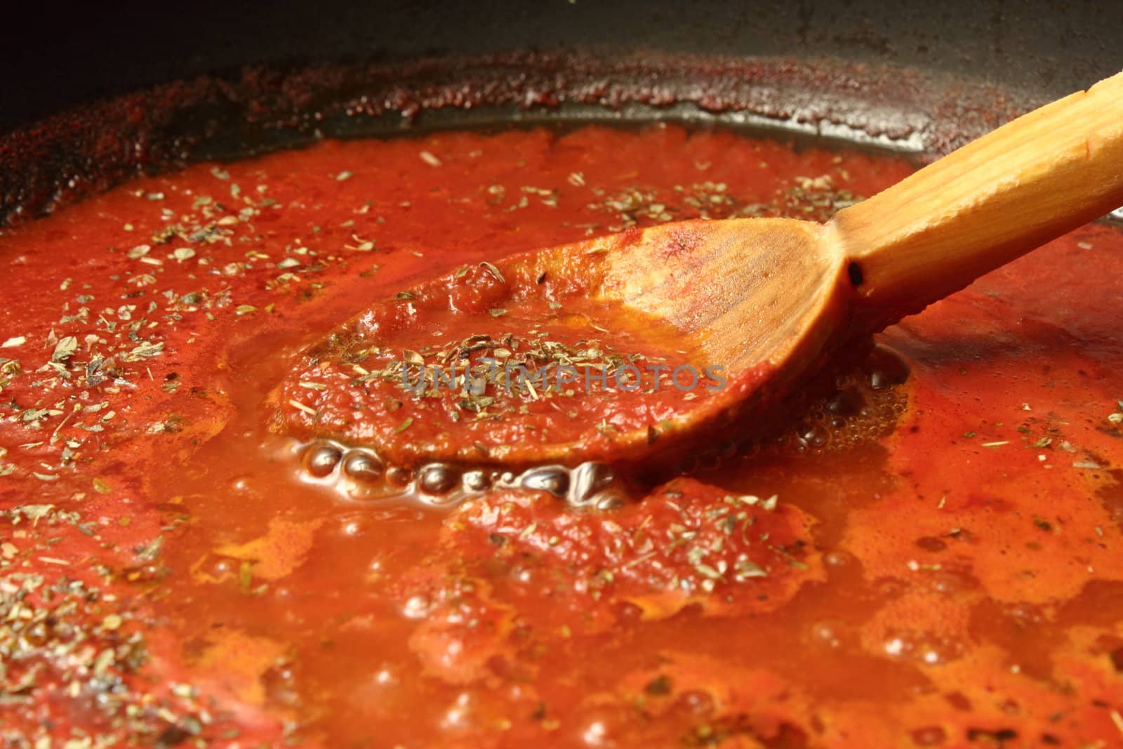 preparing tomato sauce for pizza and spaghetti