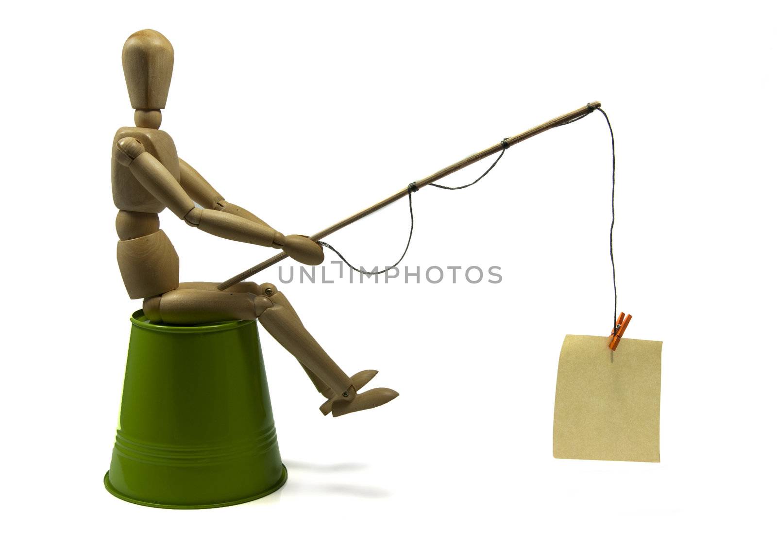 wooden doll fishing with paper place for your text