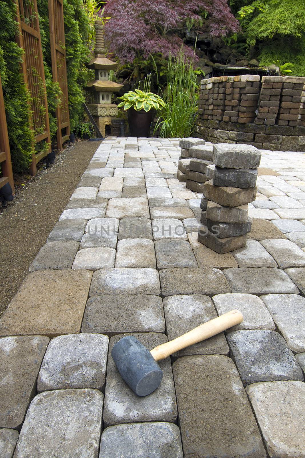 Laying Garden Pavers Patio by jpldesigns