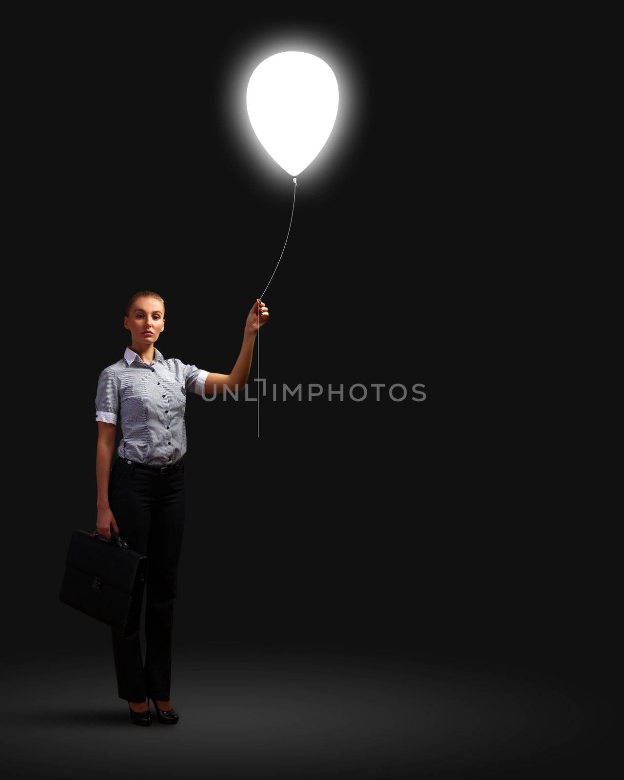 Light bulb and a business person as symbols of creativity in business