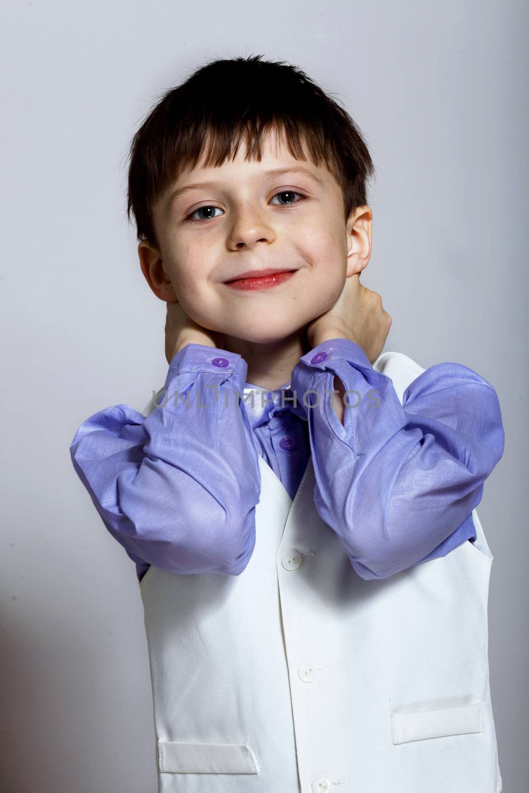 Portrait of a little boy dressed for a celebration