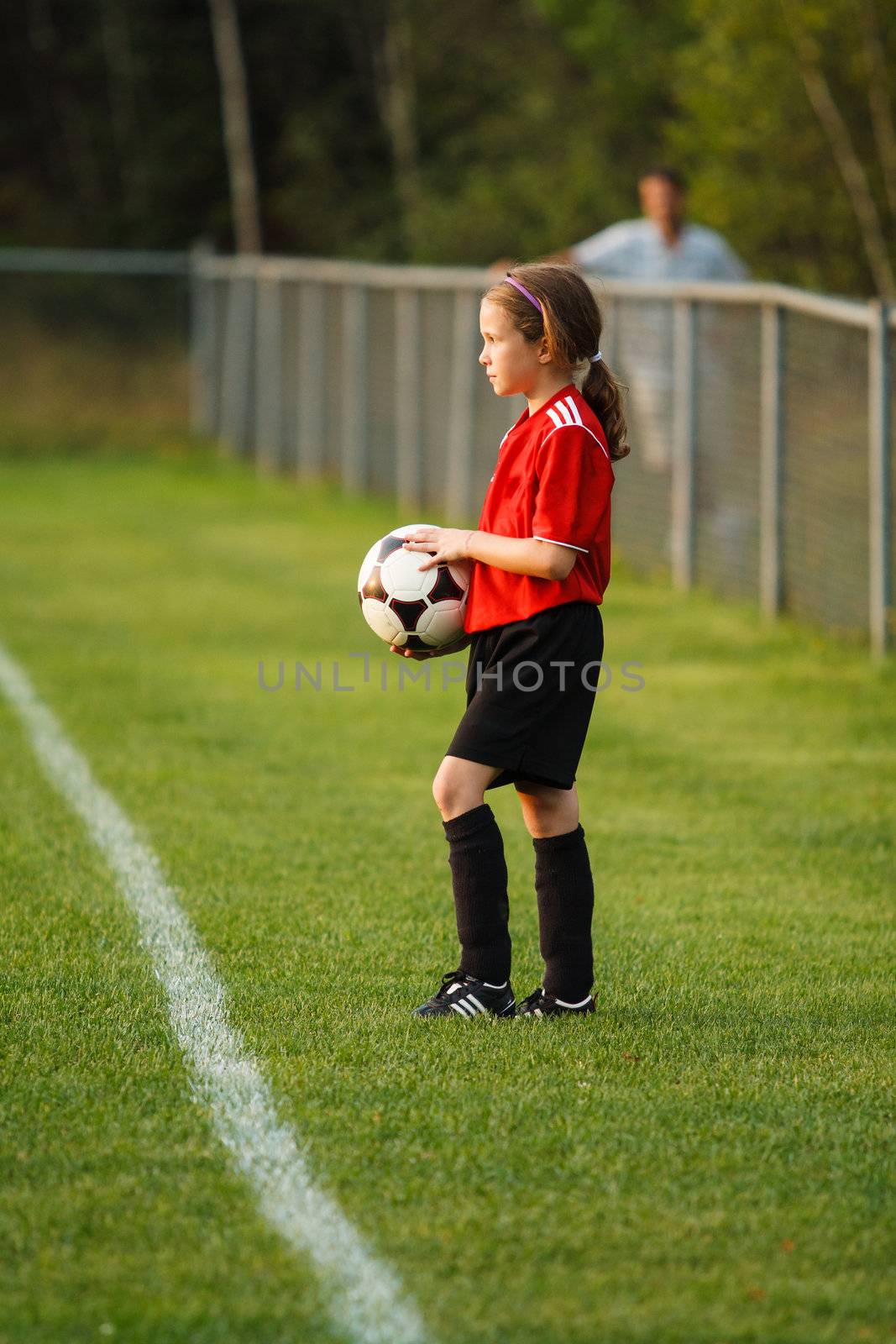 Young girl with a soccer ball