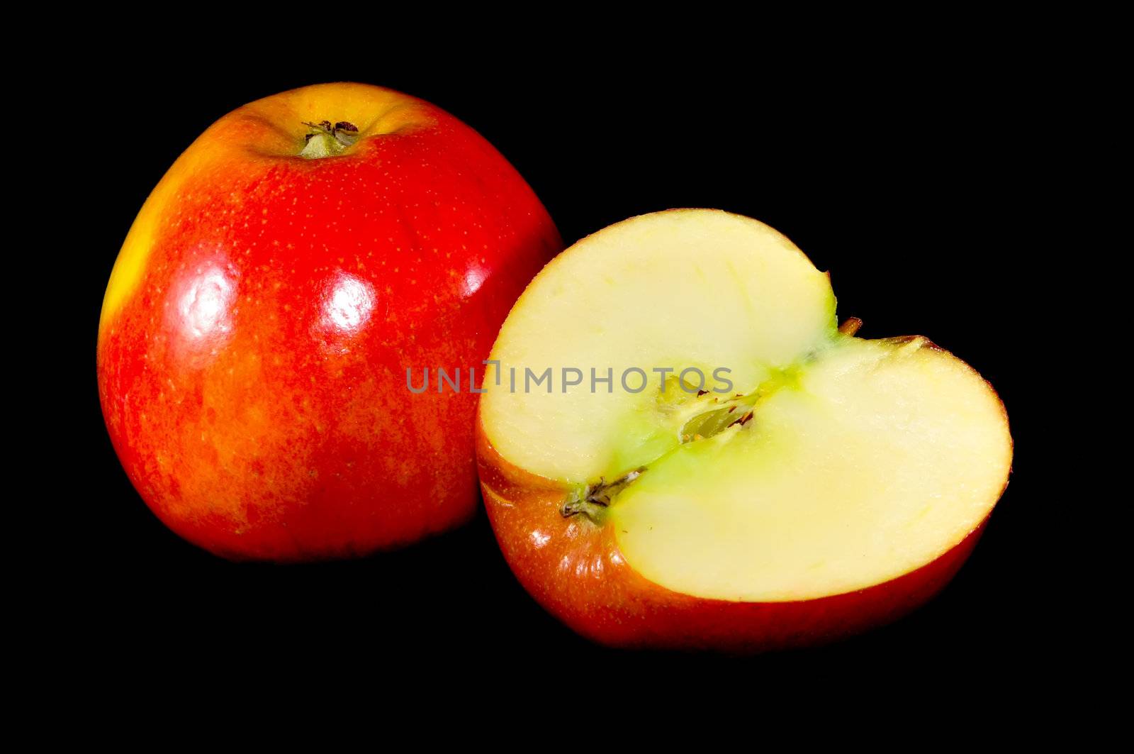 sliced apples on black background by digidreamgrafix