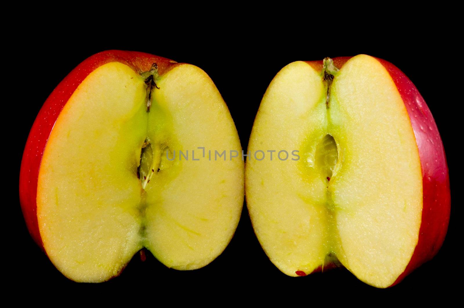 sliced apples on black background by digidreamgrafix