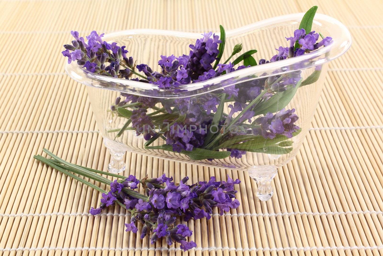 a bath tub with lavender flowers