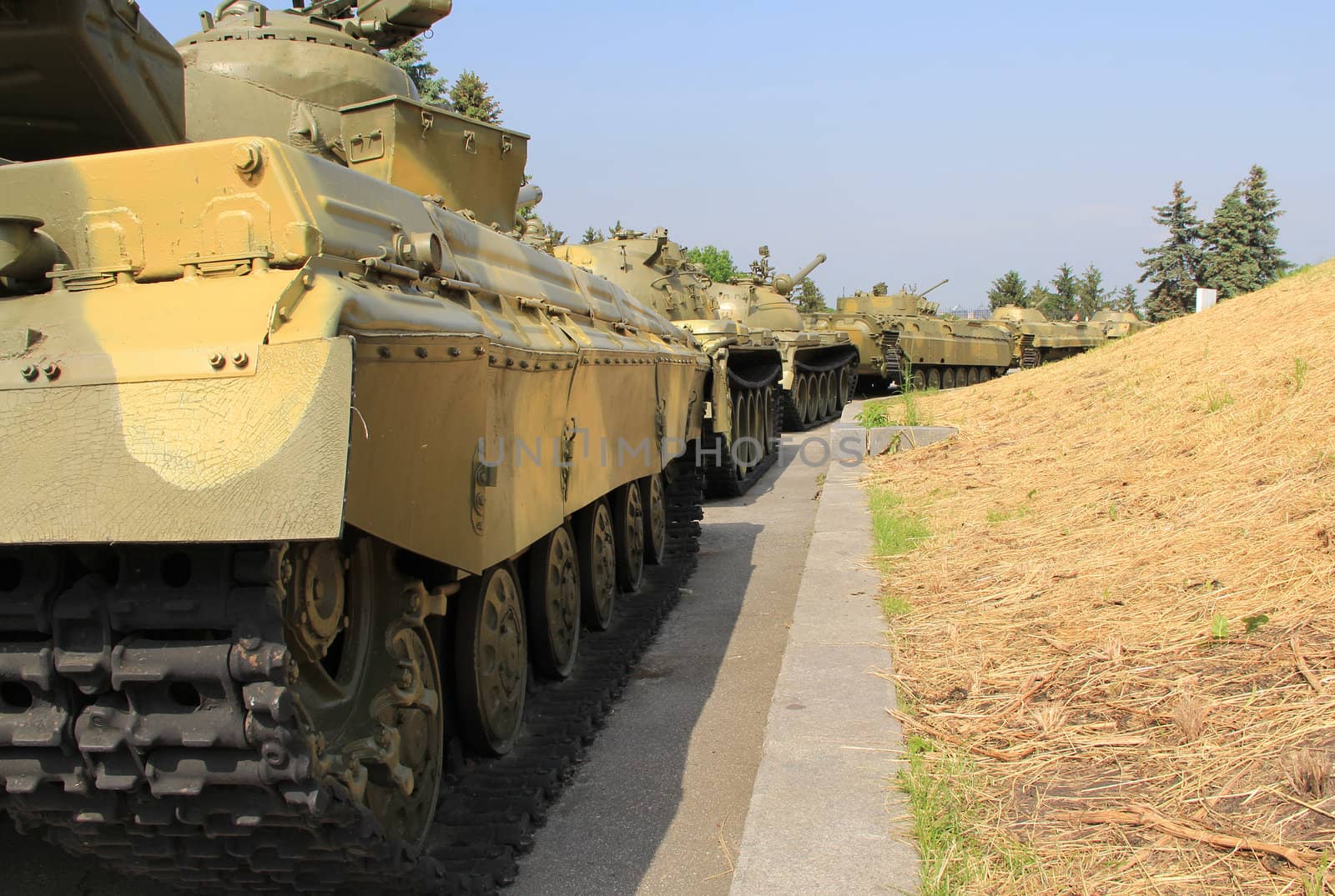 Moving armored  column against  grass background