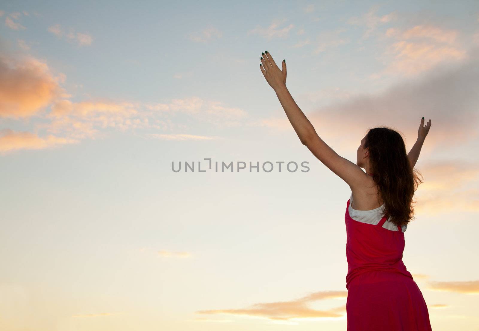 Woman staying with raised hands by AndreyKr