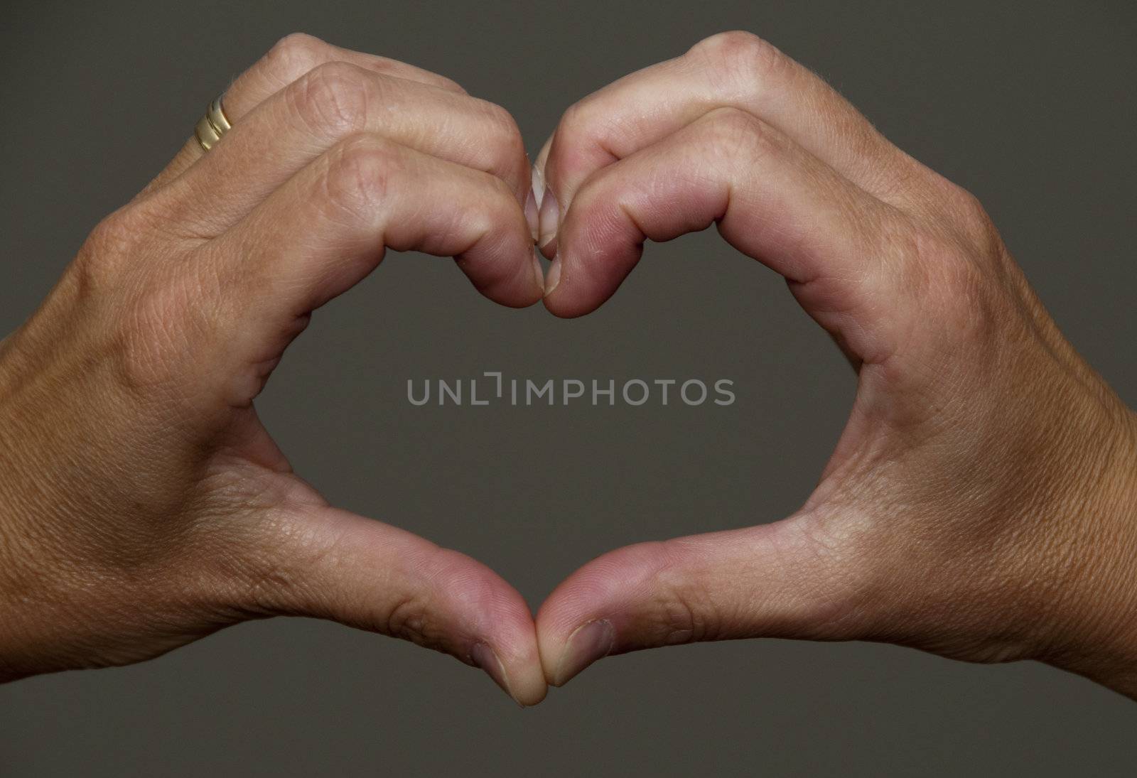 hands making a hart shape together