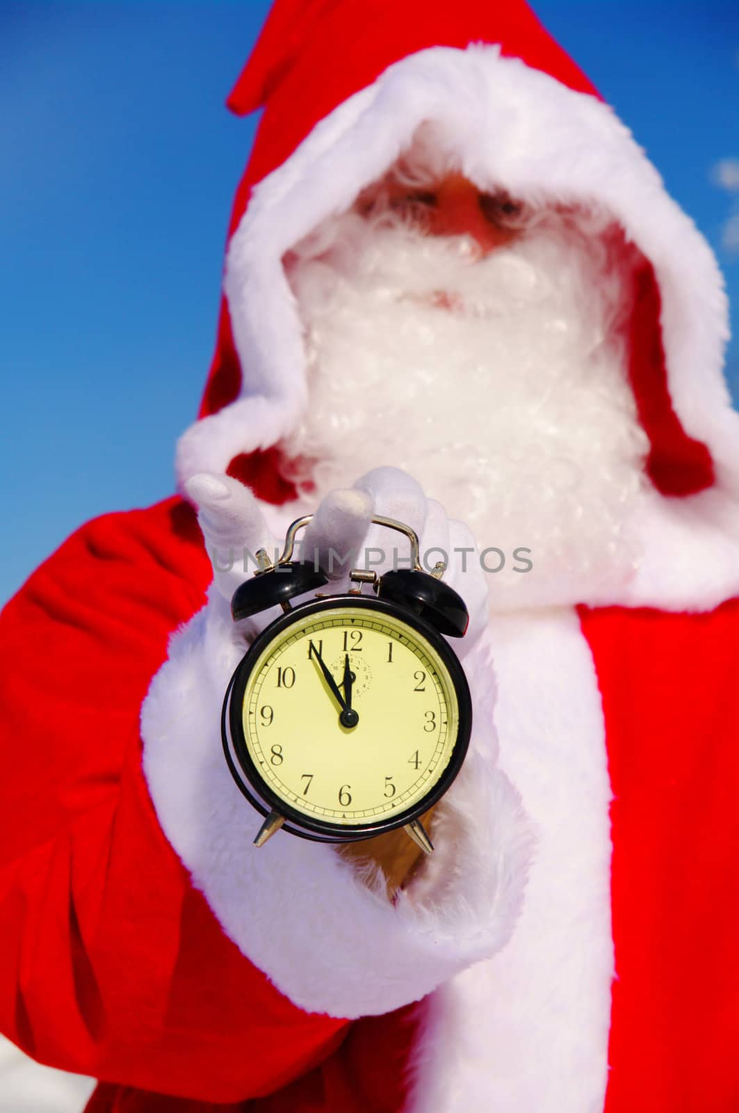 Santa Claus, Father Christmas holds watch clock