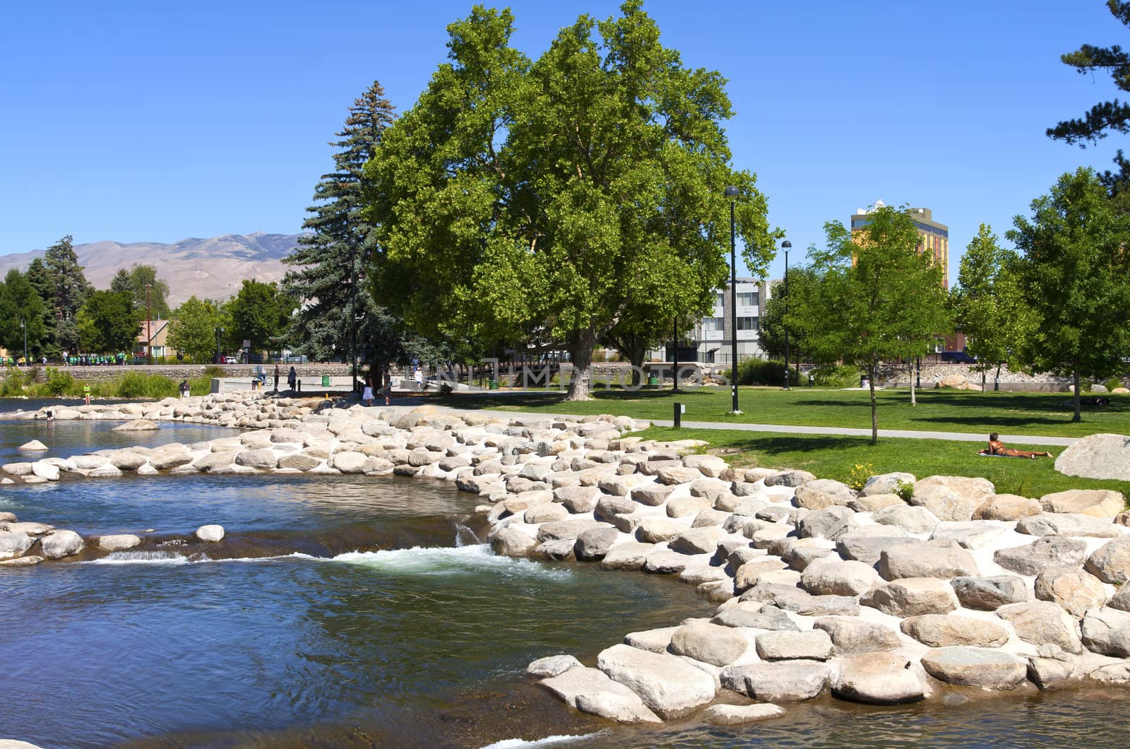 Downtown Reno public park and river with surrounding mountains.