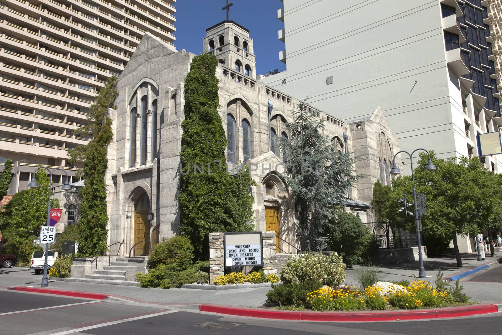 First Methodist church in Reno Nevada between modern buildings.