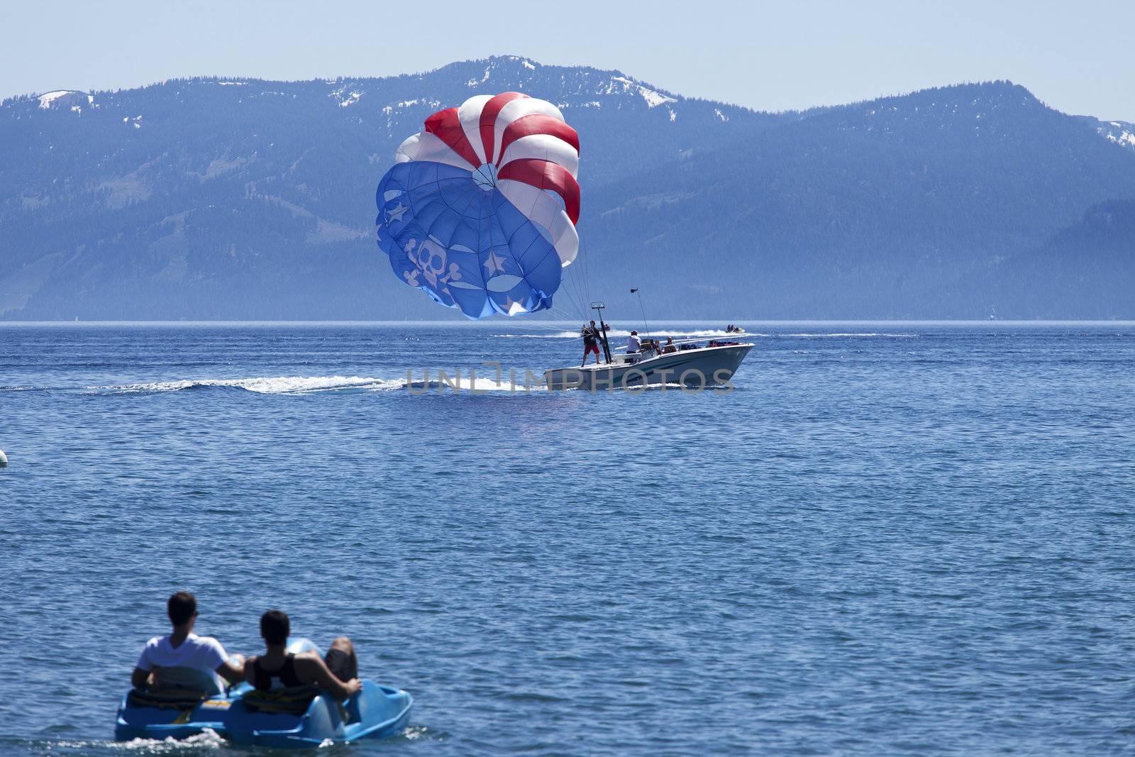 Paragliding on Lake Tahoe. by Rigucci