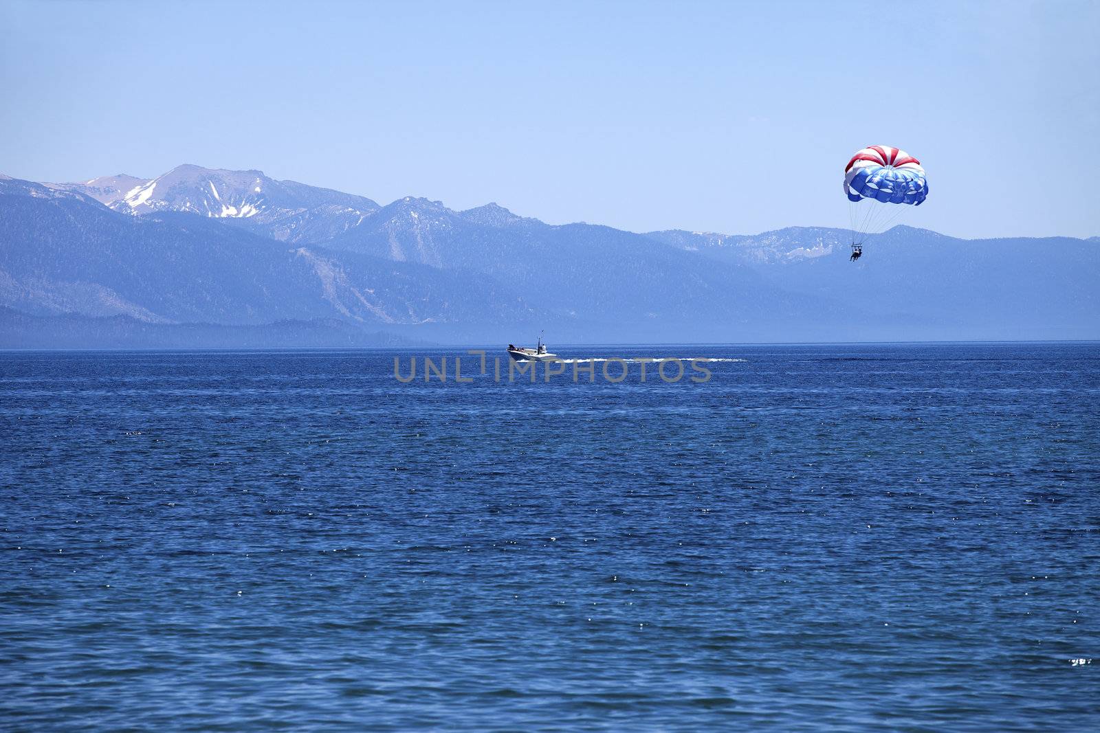 Paragliding on Lake Tahoe. by Rigucci