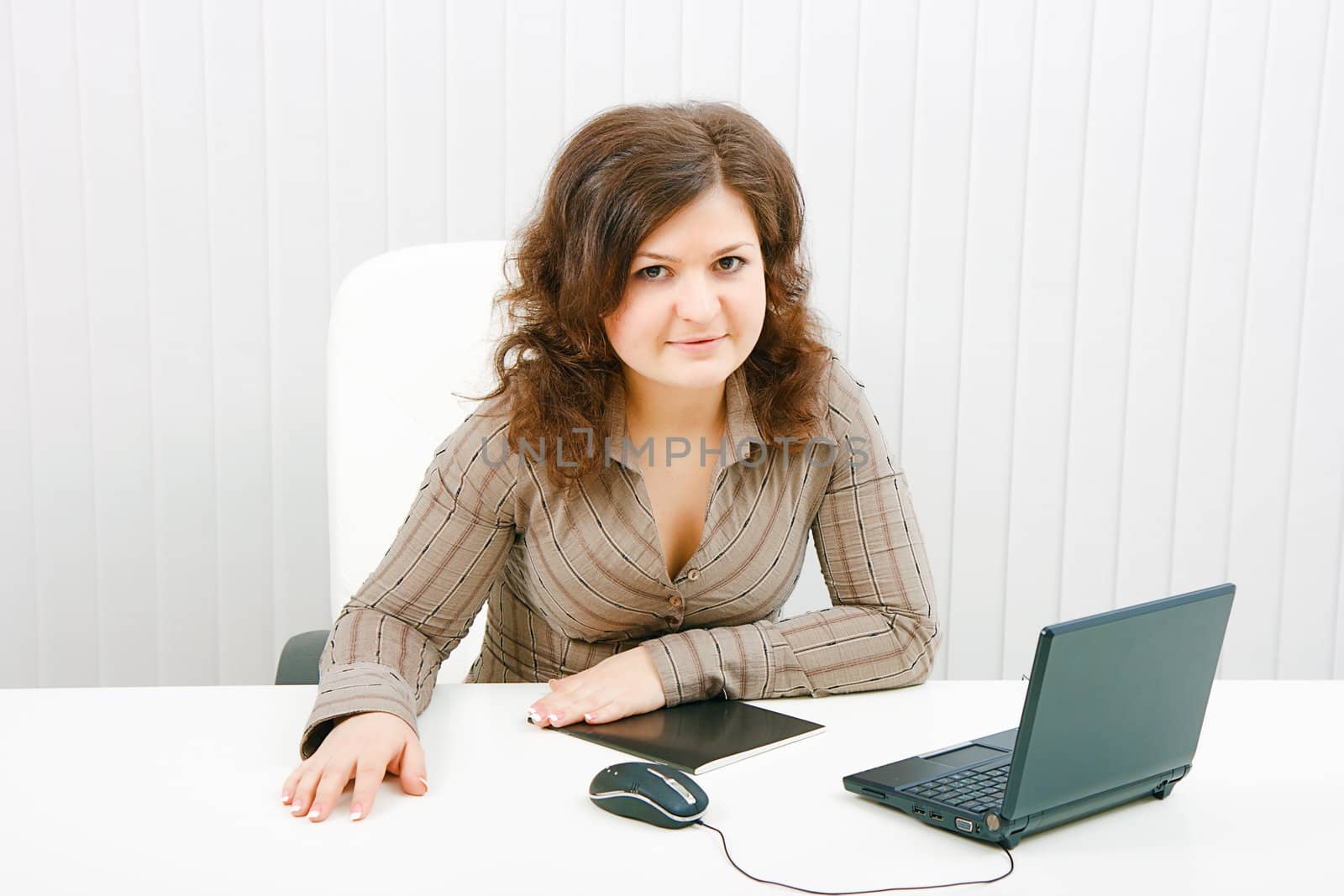 in the office of a young woman with a laptop