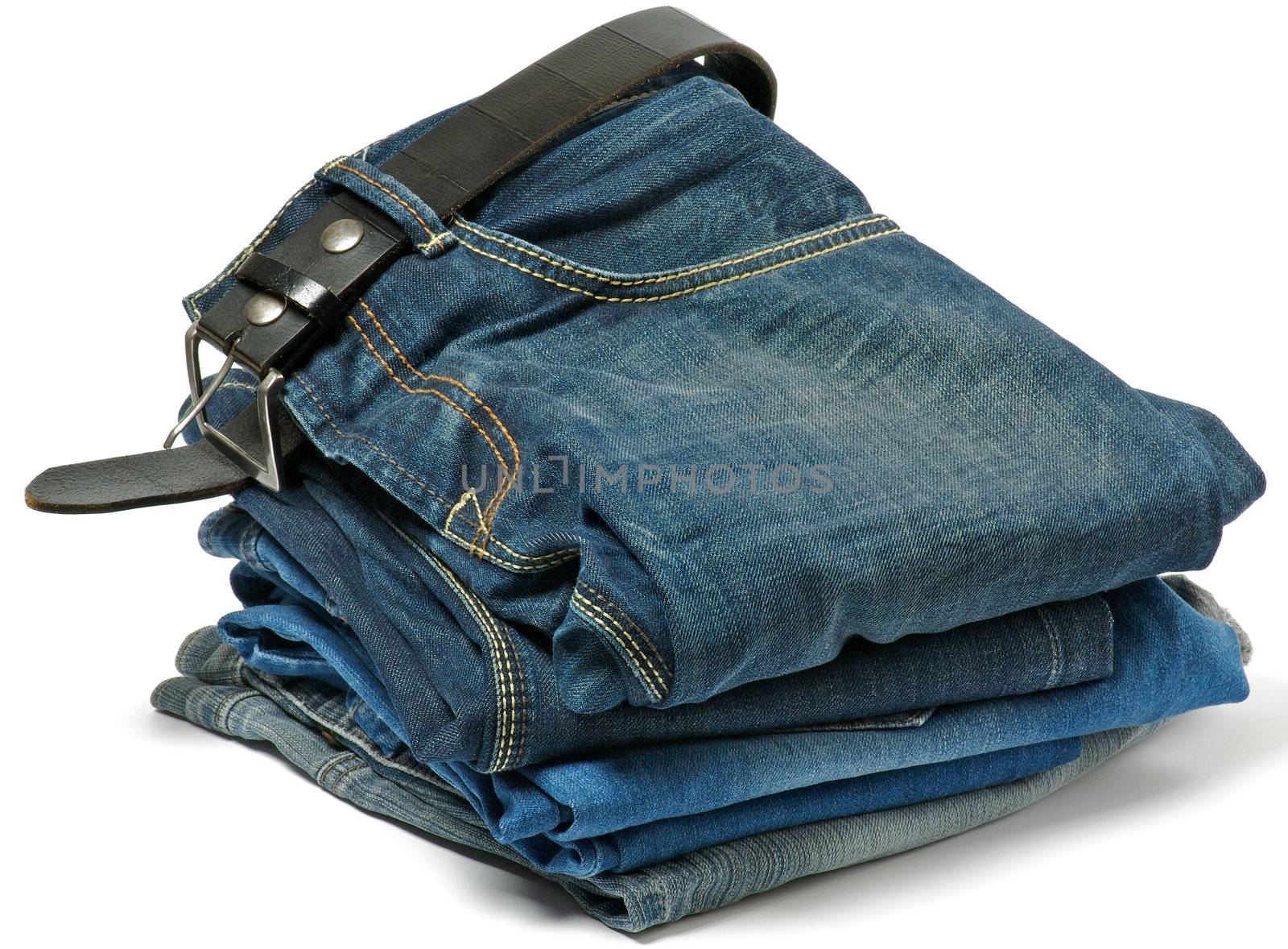 Stack of Old jeans and Belt isolated on white background