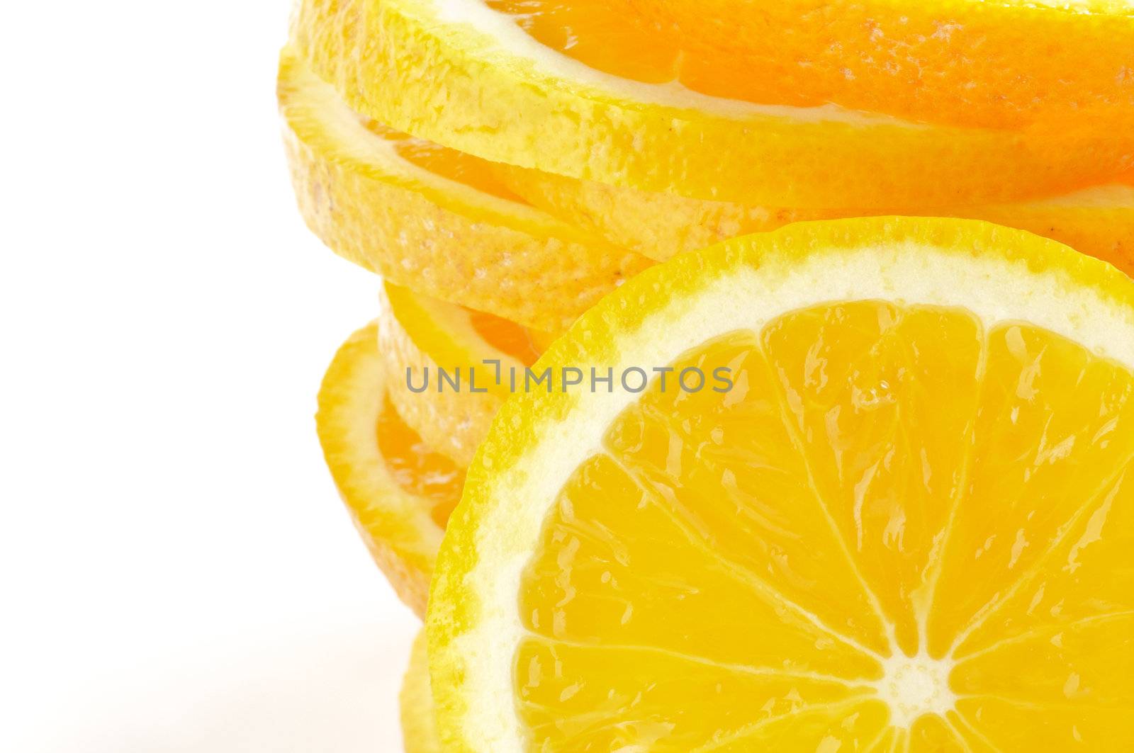 Stack of Sliced juicy fresh oranges closeup frame