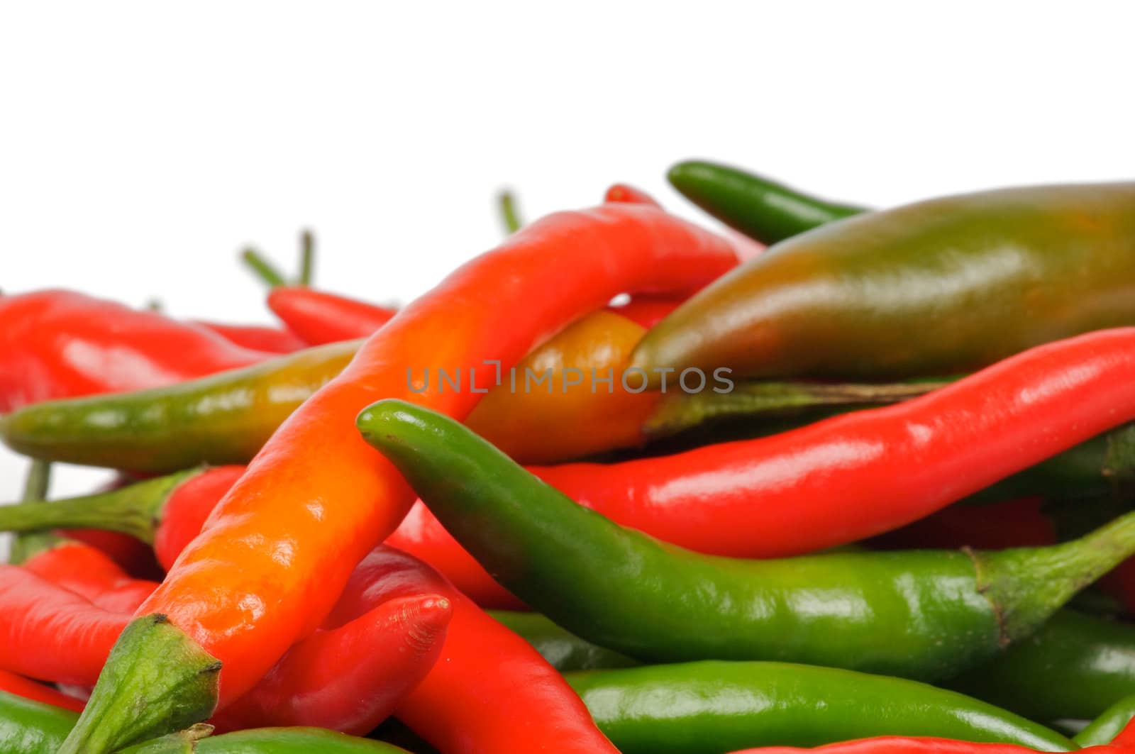 Arrangement of Fresh Red and Green Chili peppers closeup