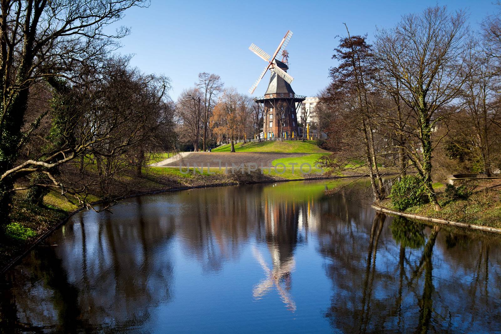windmill and it's reflection in lake in Bremen, Germany
