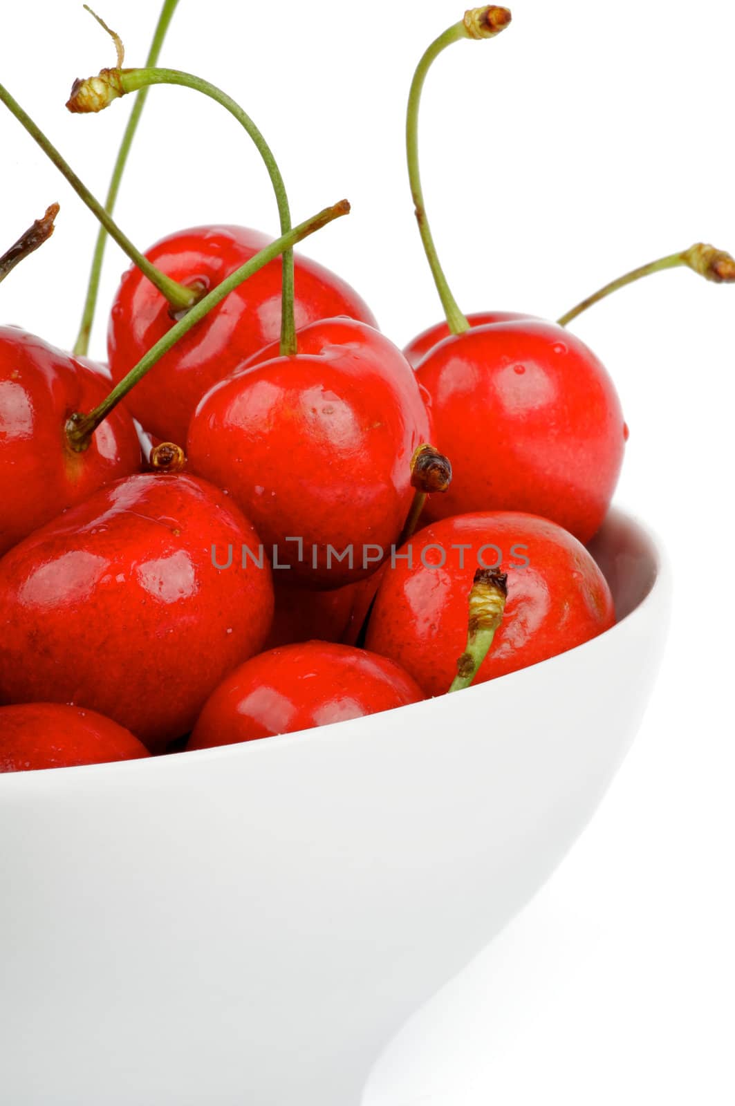 Fresh Ripe Cherry in white bowl cut out on white background