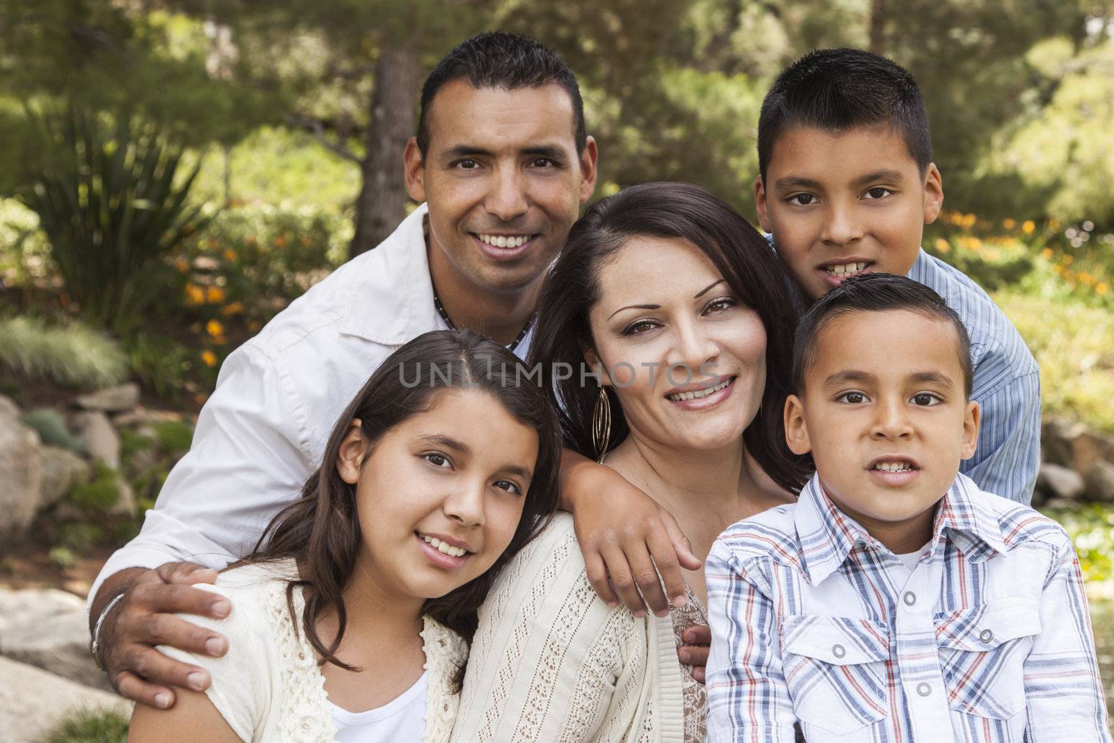 Happy Attractive Hispanic Family Portrait In the Park by Feverpitched