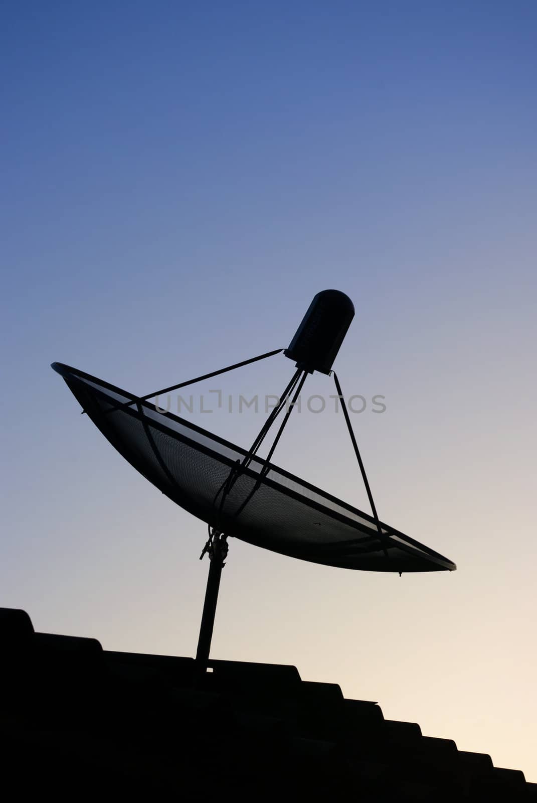 Satellite dish on the roof top with morning sky