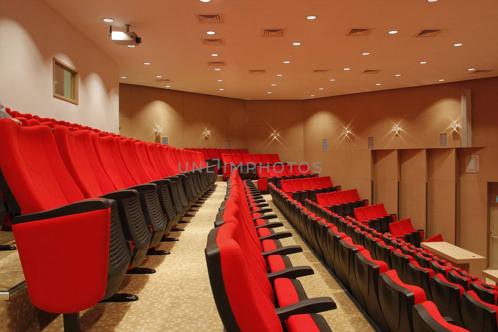 Red empty chairs in theatre