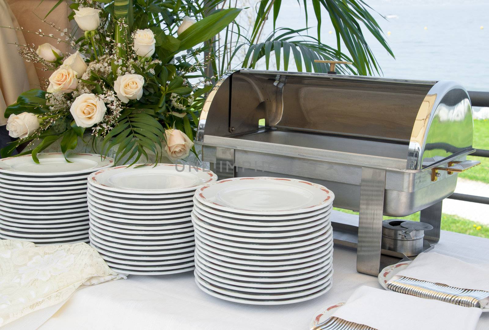 Italian Catering food warmer empty with white plate on a wedding celebration