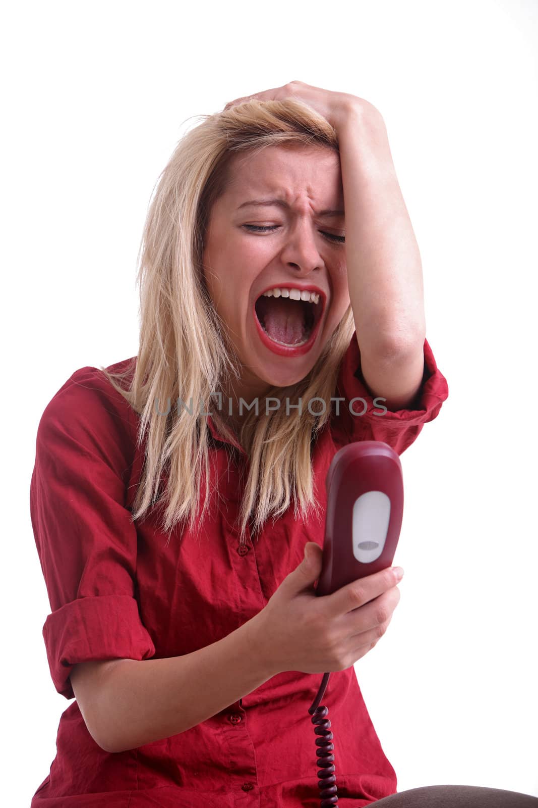 Screaming woman at telephone