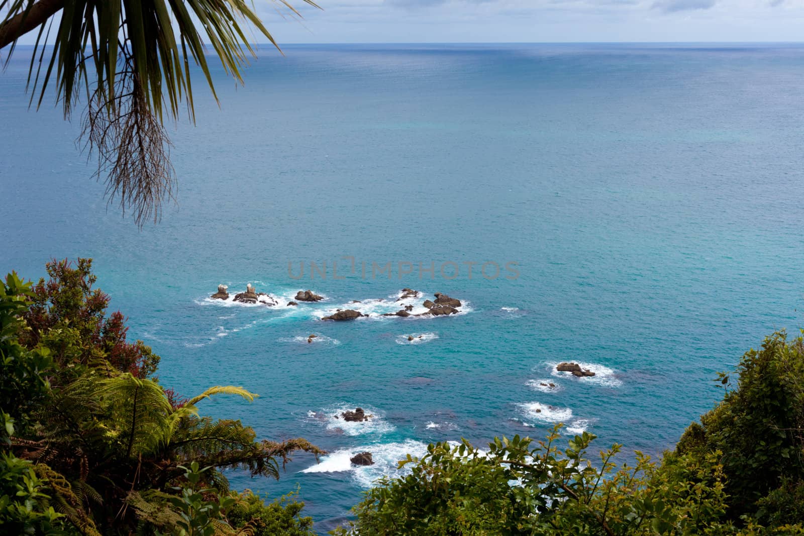 Unusual calm Tasman Sea at West Coast of South Island of New Zealand