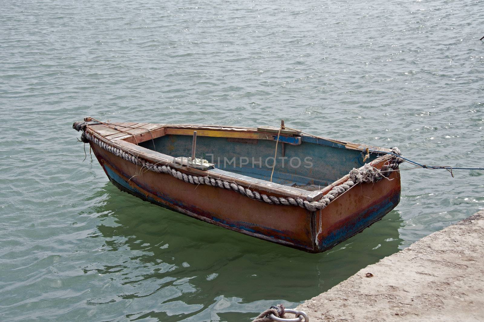 wooden boat on the sea by compuinfoto