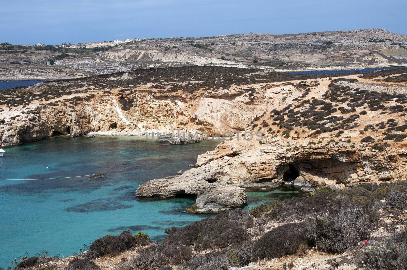 blue bay on gozo island by compuinfoto