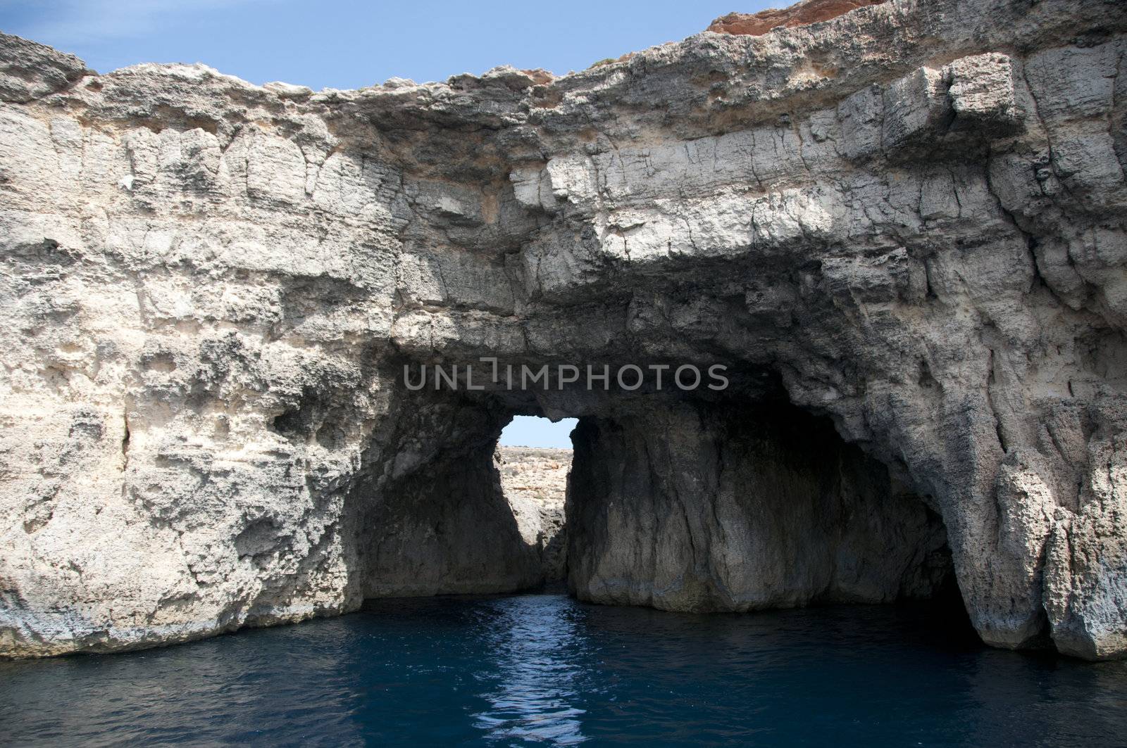 rocks and blue sea on Gozo by compuinfoto