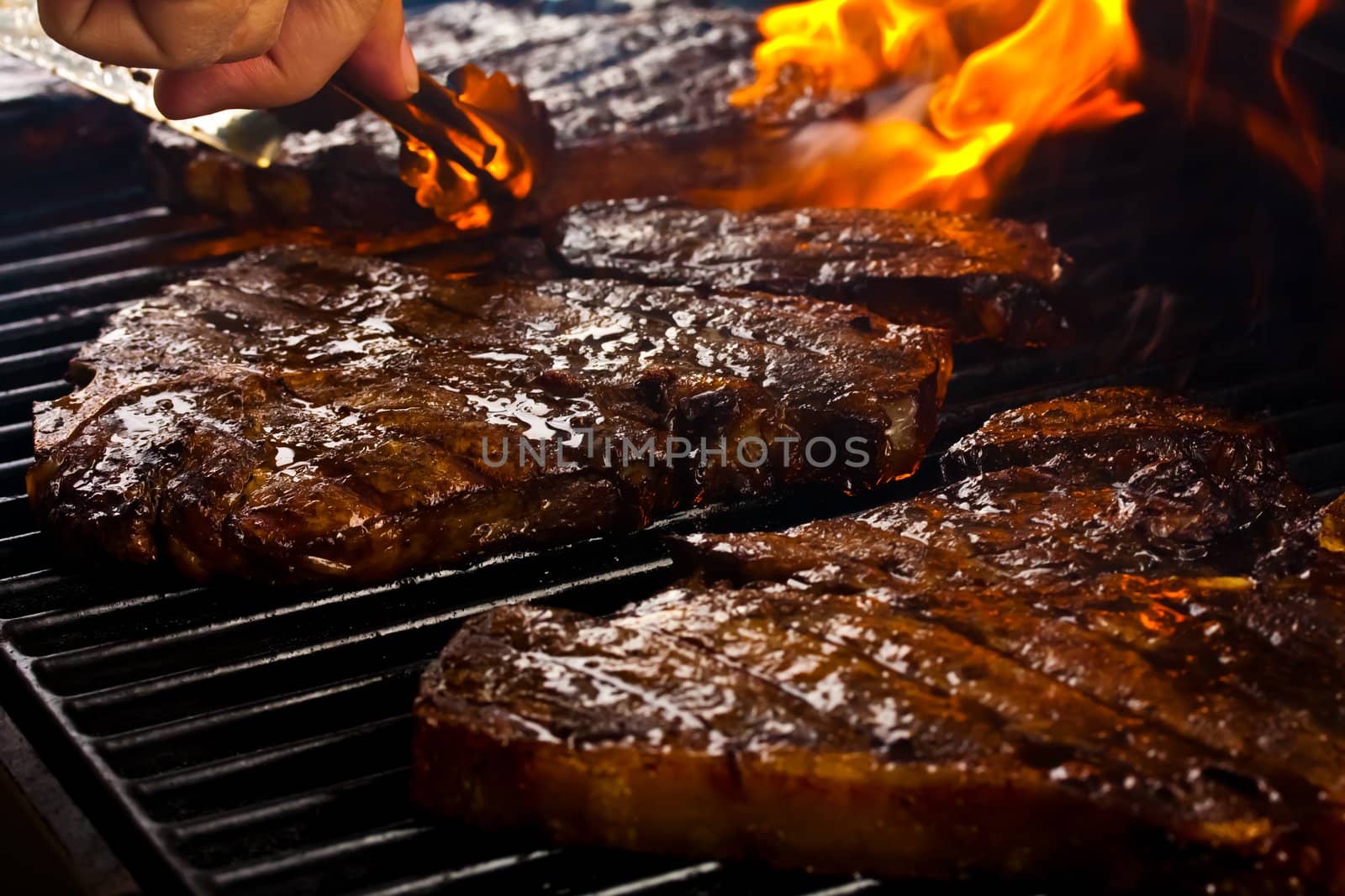 steaks grilling on the barbeque