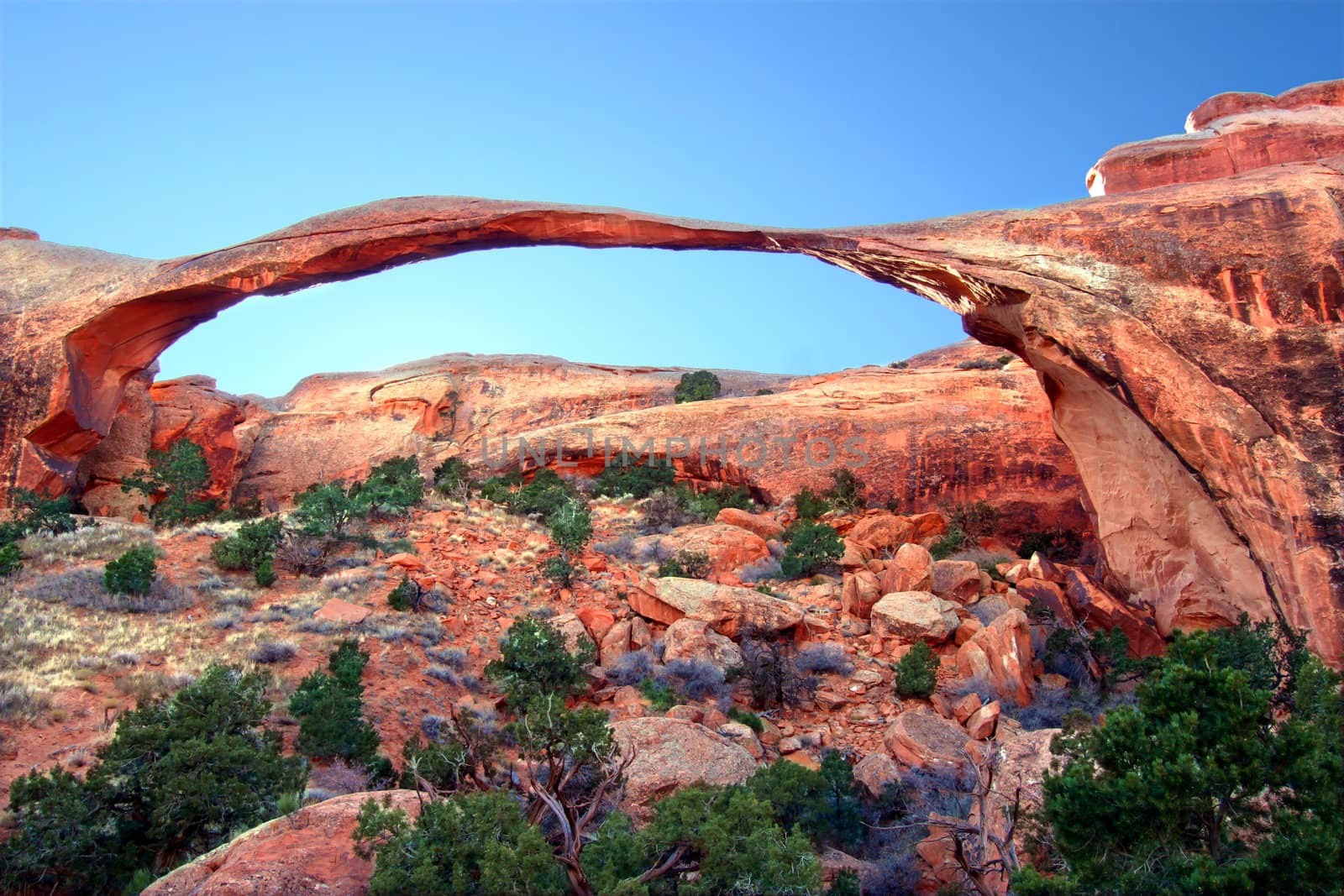 Landscape Arch stretches across the skyline at Arches National Park in Utah.