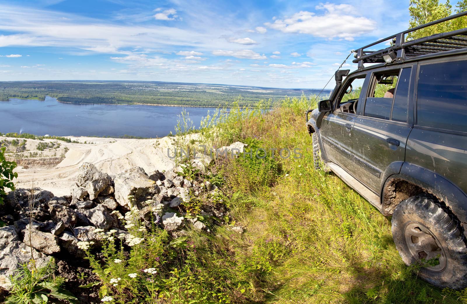 All-wheel drive SUV on the edge of a cliff by Oledjio