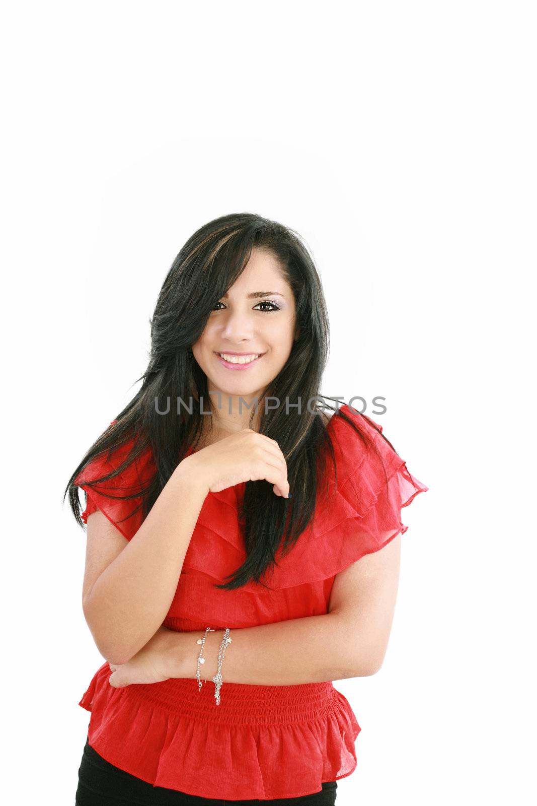 Portrait of a happy young business woman standing with folded hand against white background