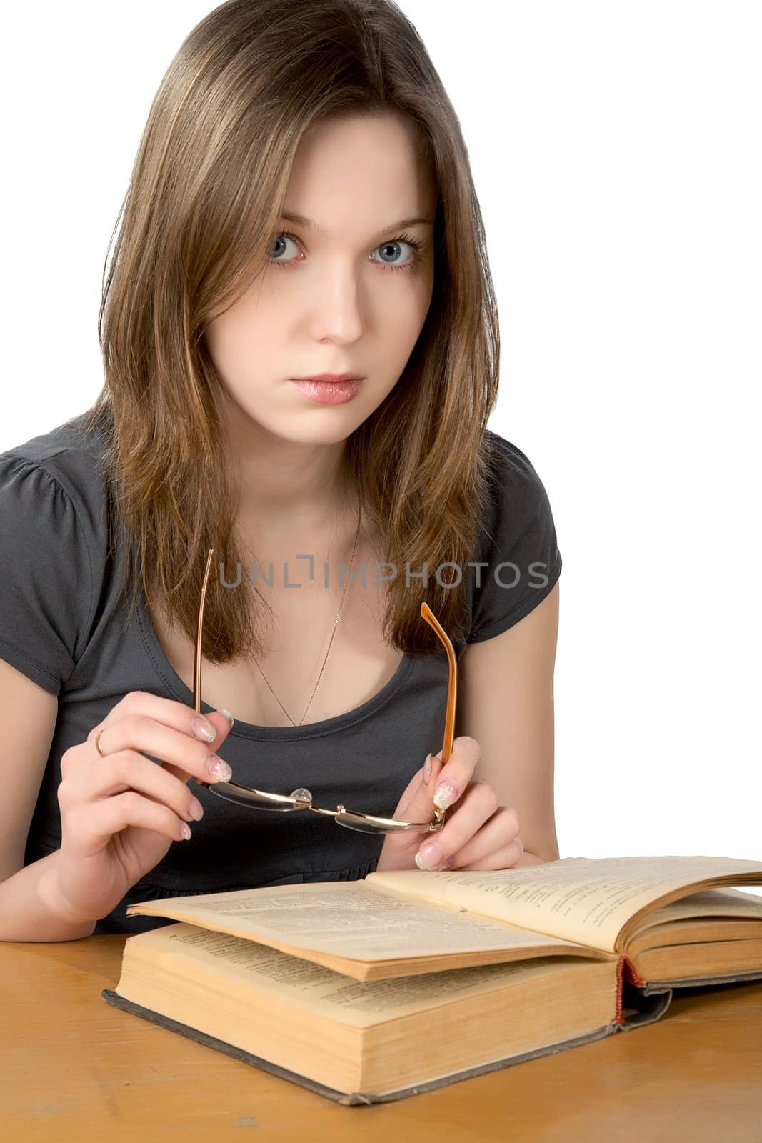 girl with glasses and the open book isolated on a white background