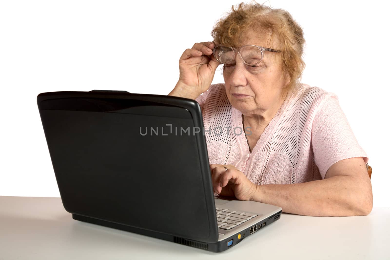 Granny with the laptop isolated on a white background
