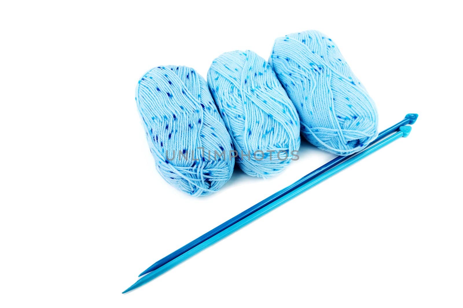  blue balls of a yarn knitting spokes isolated on white background