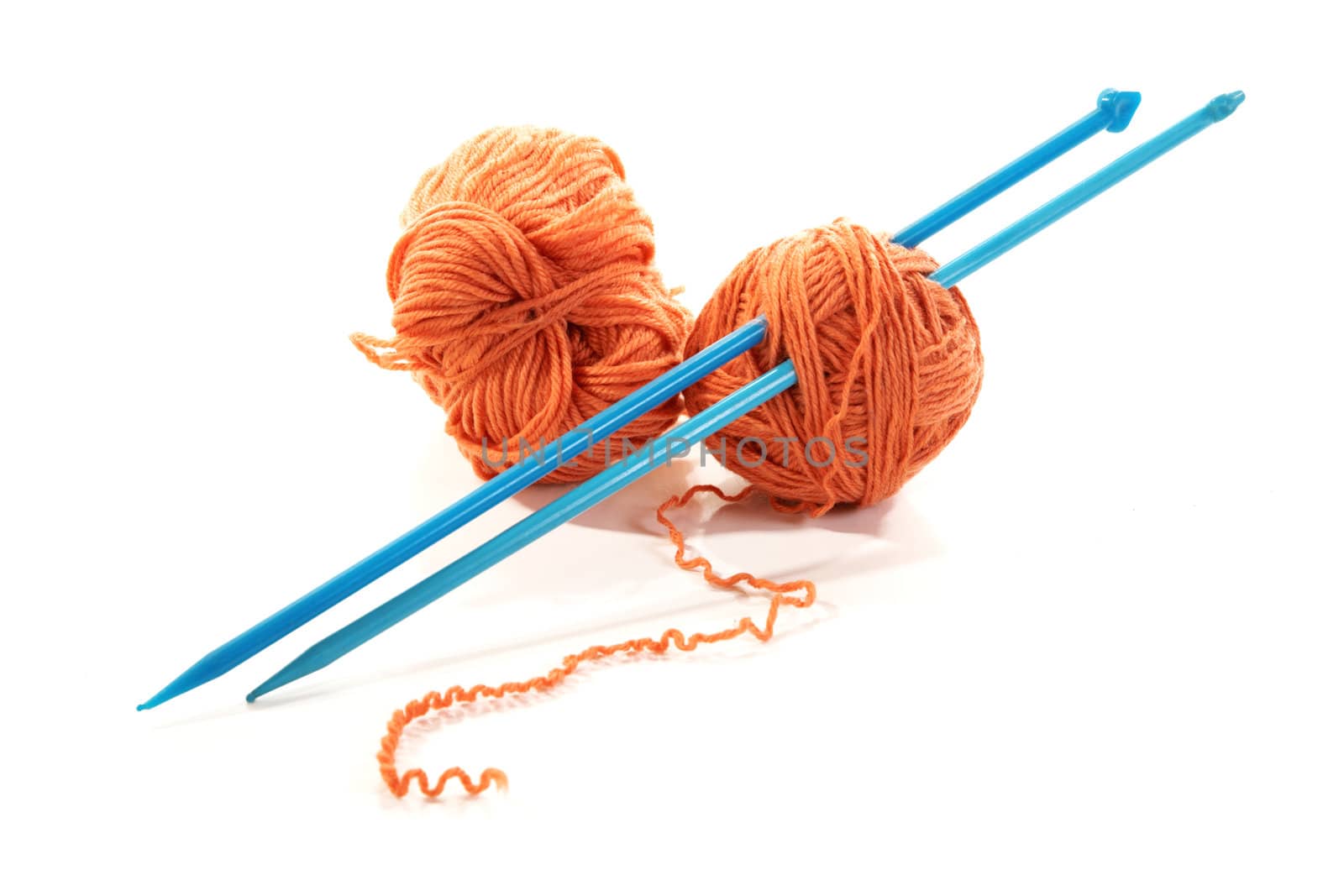 Balls of a yarn knitting spokes isolated on white background