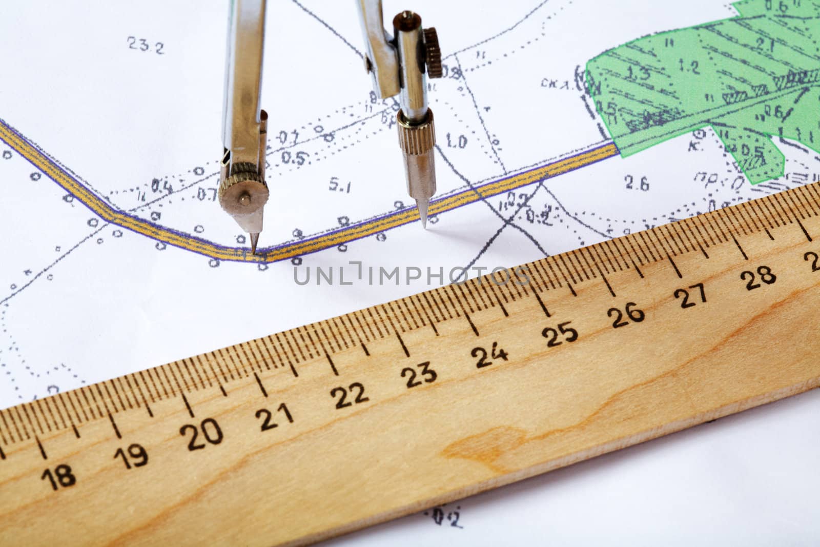 Topographic map of district with  measuring instrument and  ruler