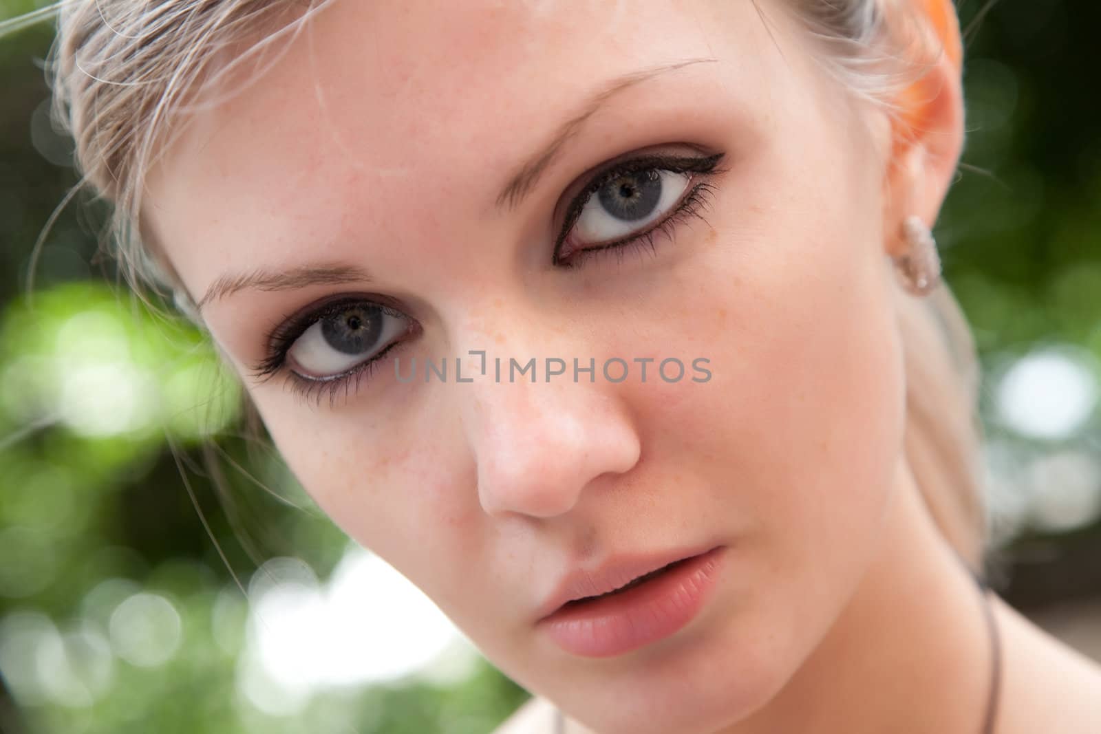 Portrait of the beautiful girl close up