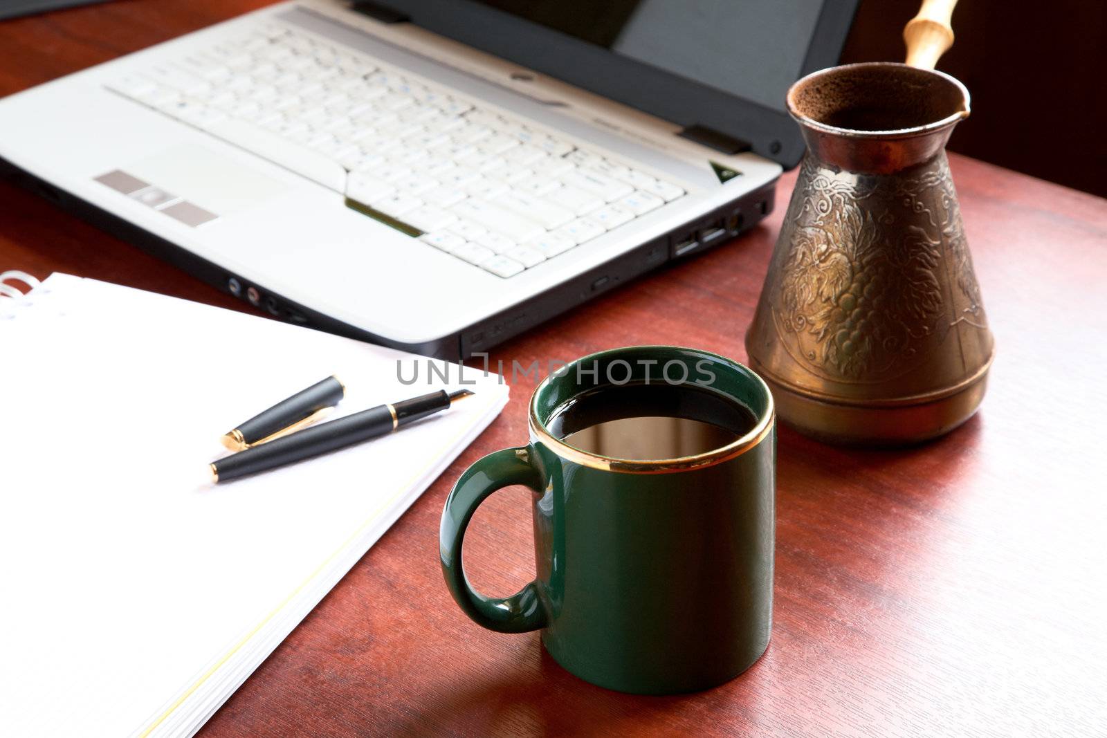 Cup of morning coffee on a table at office