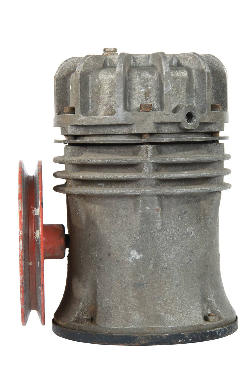 Old air compressor with pulley, isolated on white background