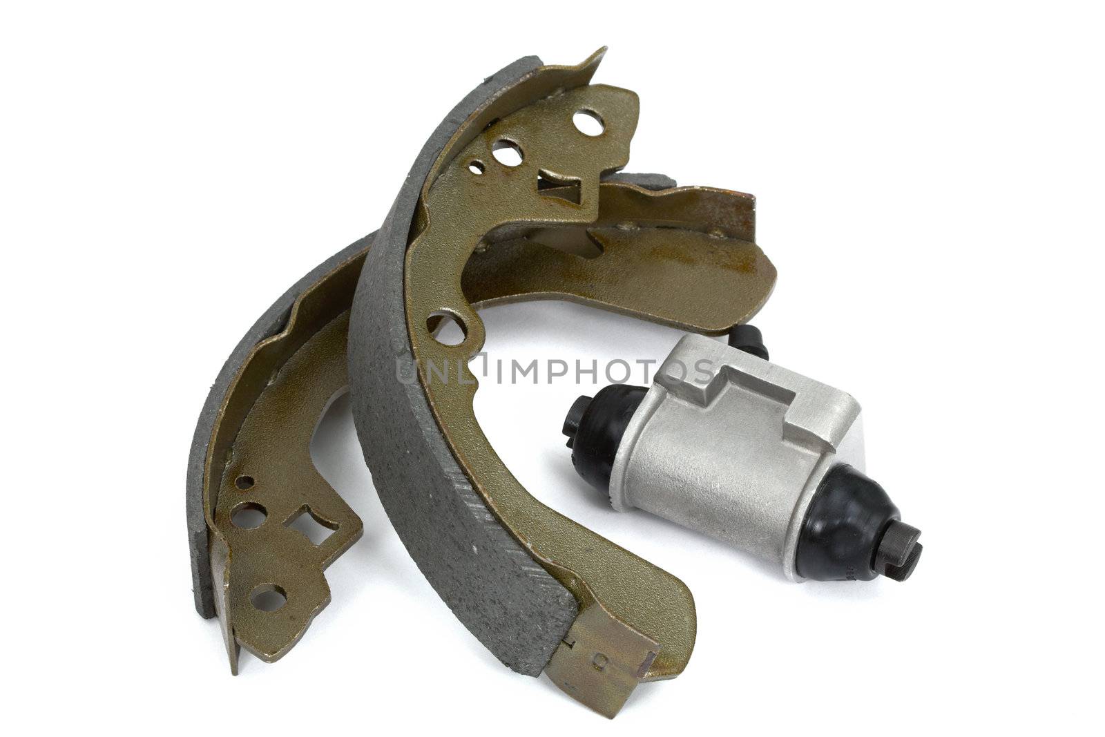 New brake pads and cylinder brake drum, isolated on a white background