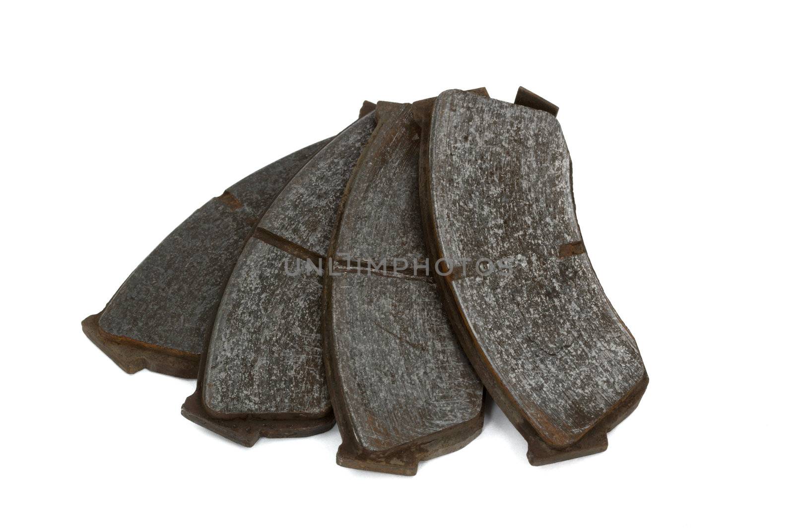 Old brake pads disk brake, isolated on a white background